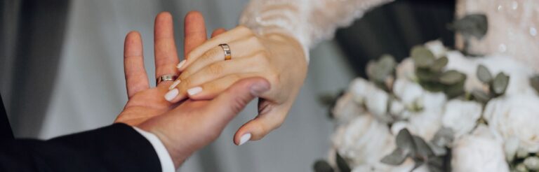 A married couple holding hands